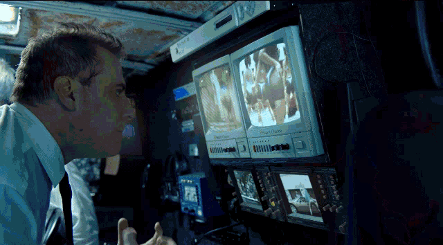 a man is looking at a screen that says panasonic