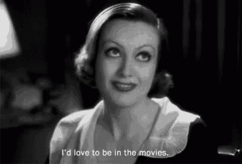 a woman says i 'd love to be in the movies in a black and white photo