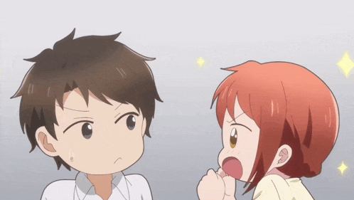 a man and a woman are standing next to each other and looking at each other