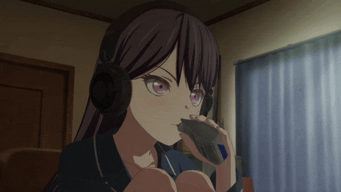 a girl wearing headphones is drinking from a glass
