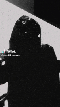a black and white photo of a person with a tiktok logo