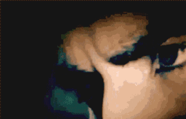 a close up of a person 's eye with the letter l on the bottom right