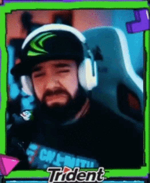 a man with a beard wearing headphones and a shirt that says call of duty trident