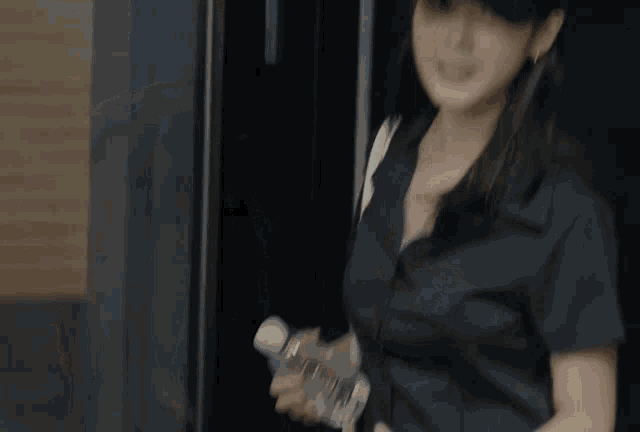a woman wearing a black hat that says ds