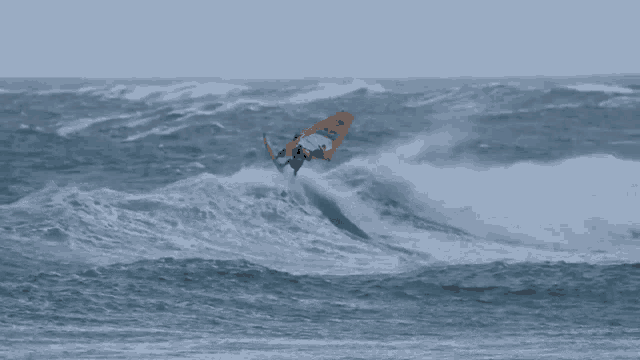 a person is riding a wave on a surfboard that says ' o'neill ' on the side