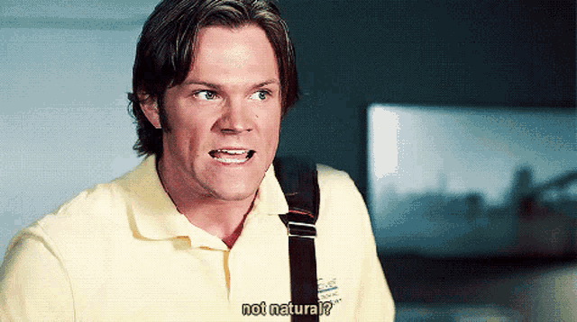 a man in a yellow polo shirt says not natural