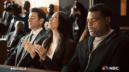 a group of people sitting in a courtroom with the nbc logo on the bottom