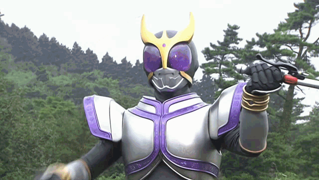 a masked superhero is holding a sword in his hand