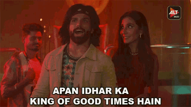 a man standing next to a woman with the words " apan idhar ka king of good times hain " written below him