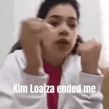 a woman is making a funny face and says kim loaiza ended me