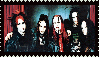a group of people are posing for a picture and one of them is wearing a shirt that says ' nirvana '