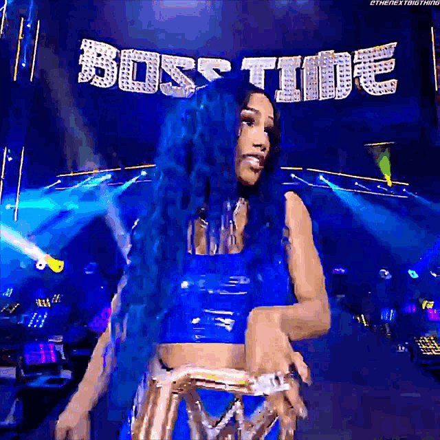 a woman with blue hair is standing in front of a sign that says " boss time "