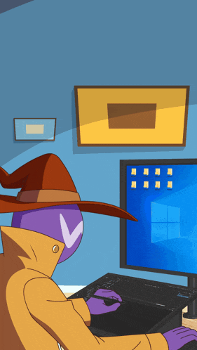 a cartoon character in a witch hat is using a computer