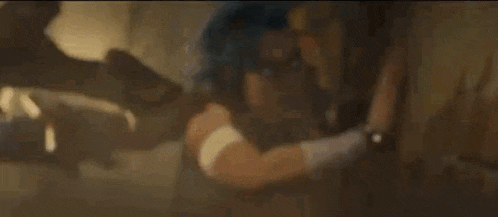 a man and a woman are standing next to each other in a dark room in a video game .