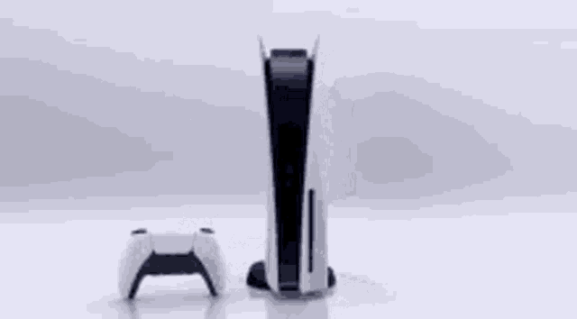 a playstation 5 console is sitting on a table next to a controller .