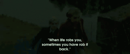 a girl in a red coat is walking next to a boy in a suit and tie