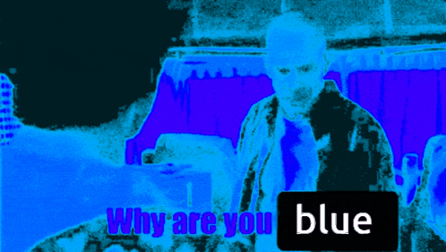 a man stands in front of a blue background with a sign that says why are you blue