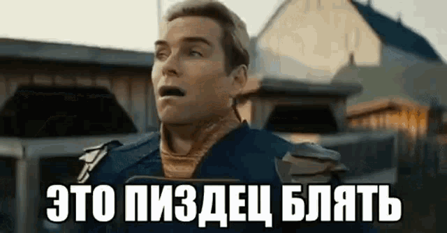 a man in a superhero costume is standing in front of a building in a foreign language .