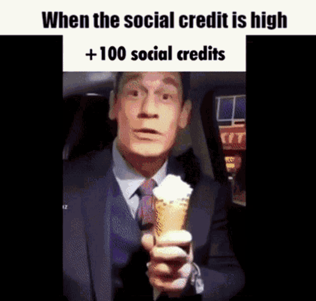 a man in a suit and tie is holding an ice cream cone .