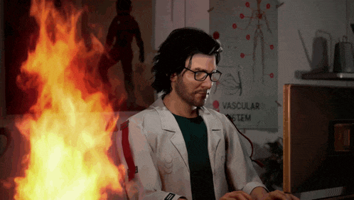 a man in a lab coat is typing on a computer in front of a poster that says vascular system