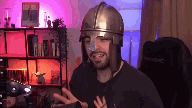a man wearing a helmet with the word basketball on a shelf behind him