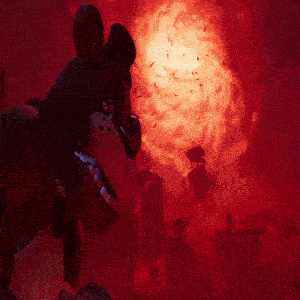a person is standing in front of a large red light