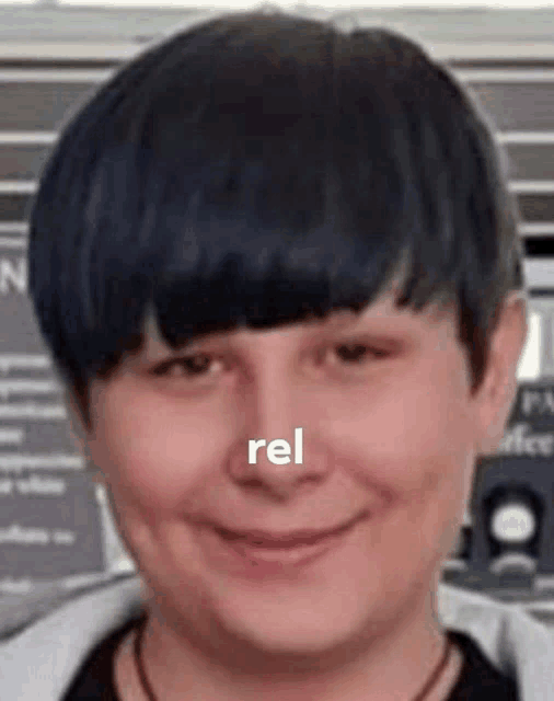 a close up of a person 's face with the word rel written on it .