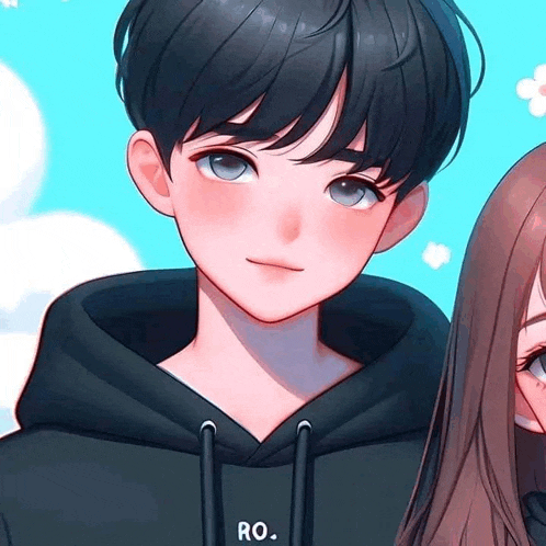 a boy and a girl are standing next to each other in a hoodie .