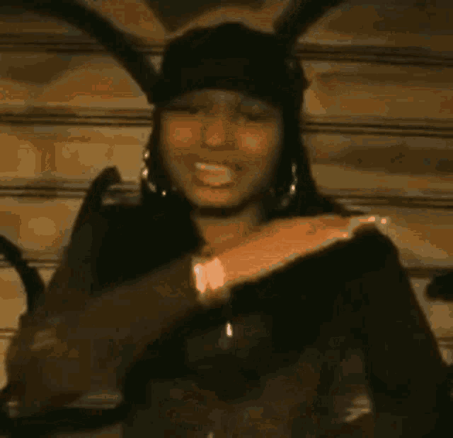 a woman wearing a hat with bunny ears on it