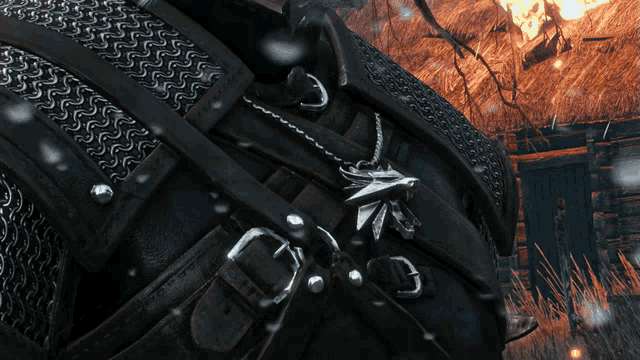 a close up of a necklace with a bird shaped pendant