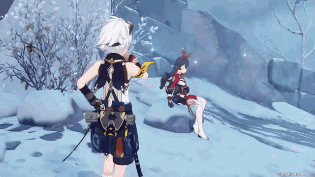 a screenshot of a video game shows a boy and a girl standing in the snow
