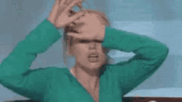 a woman in a green sweater is covering her eyes with her hands and the words " fim de ferias não " are written above her .