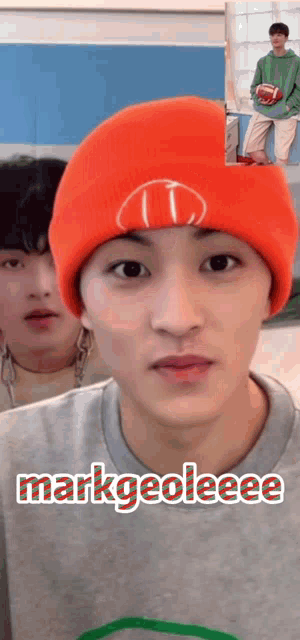 a young man wearing an orange beanie says markgeoleee