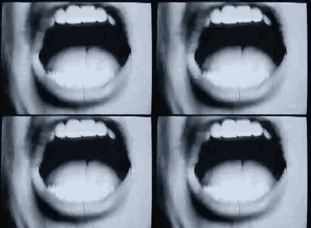 a black and white photo of a person 's mouth open .