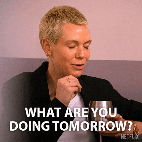 a woman holding a glass with the words " what are you doing tomorrow " below her