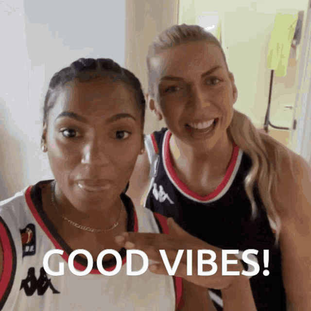 two women posing for a picture with the words good vibes written on the bottom