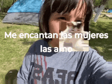 a girl is taking a selfie in front of a tent with the words me encantan las mujeres las amo