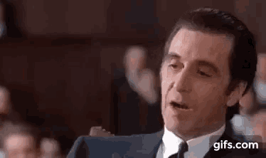 a man in a suit and tie is saying `` i 'm just getting warmed up ''