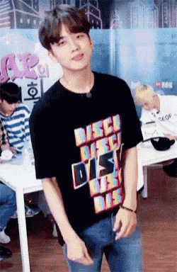 a young man wearing a black t-shirt that says disco must die