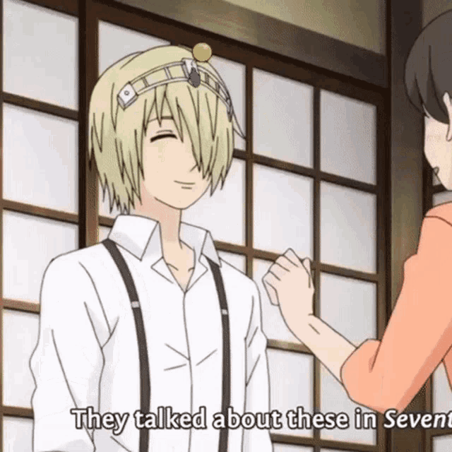 a man with a tiara on his head is talking to a woman and they talked about these in seventh
