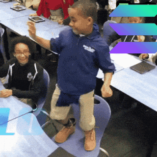 a boy in a blue shirt that says ' brooklyn school ' on it