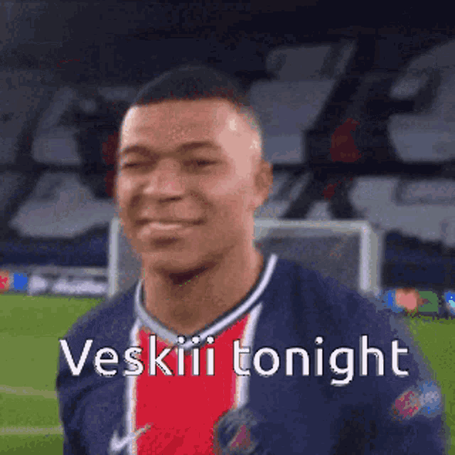a soccer player is smiling on a field and says vesiii tonight