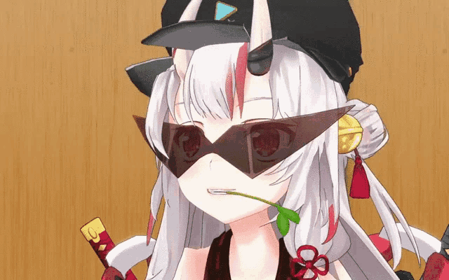 a girl with horns wearing sunglasses and a baseball cap
