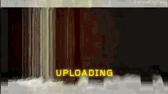 a screen that says ' uploading ' on it in yellow