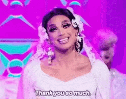 a woman in a white dress is smiling and says thank you so much