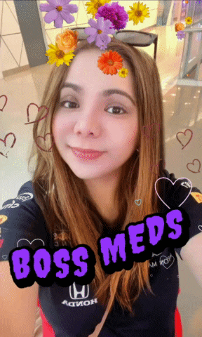 a woman with flowers in her hair and the words boss meds