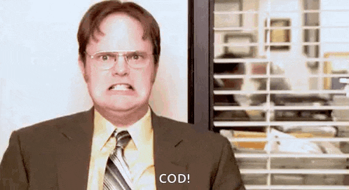 a man in a suit and tie is making a funny face and saying `` cod '' .