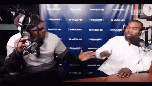 two men are in front of a siriusxm banner
