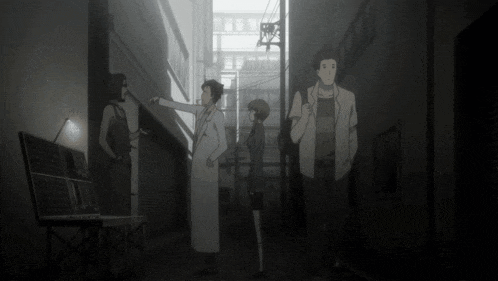 a group of people standing in a dark alleyway with a sign that says ' tokyo ' on it