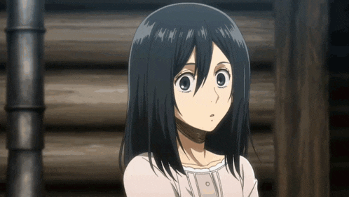 a girl with black hair is standing in front of a wooden wall